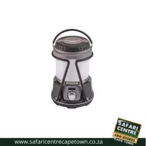 Portable camping lantern in gray and black with a top handle and power switch at the base. Includes Safari Centre branding watermark in the corner.